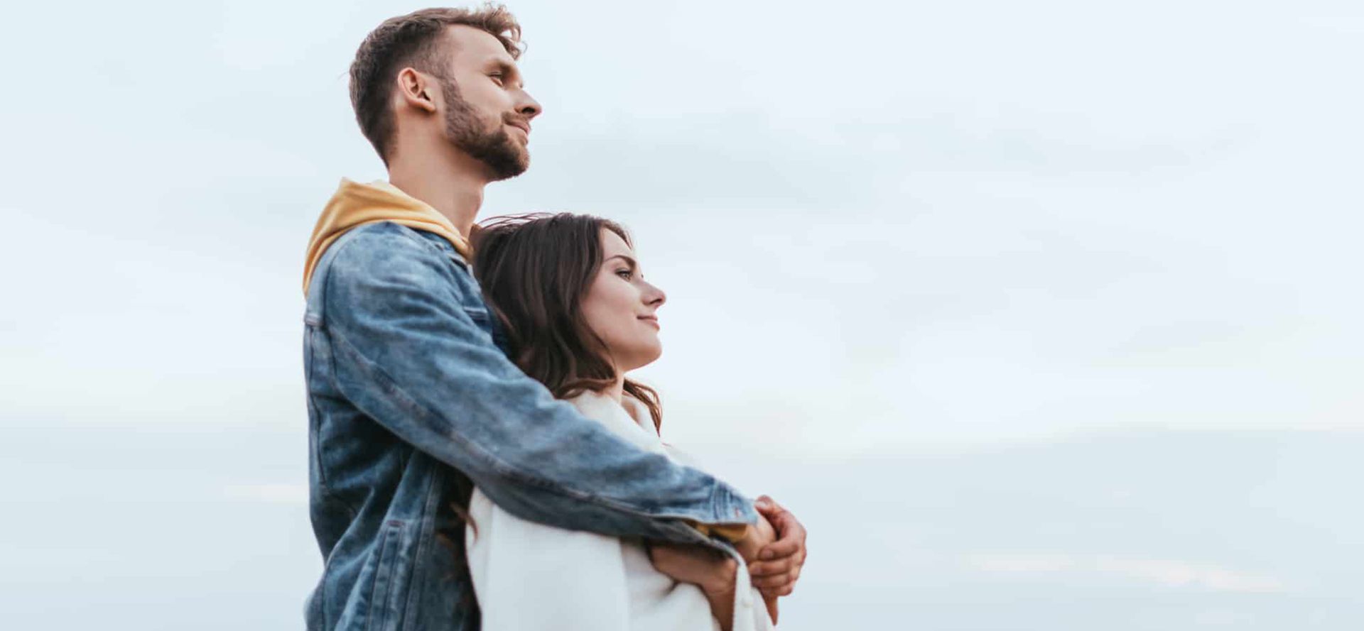 A Capricorn man hugging a woman.