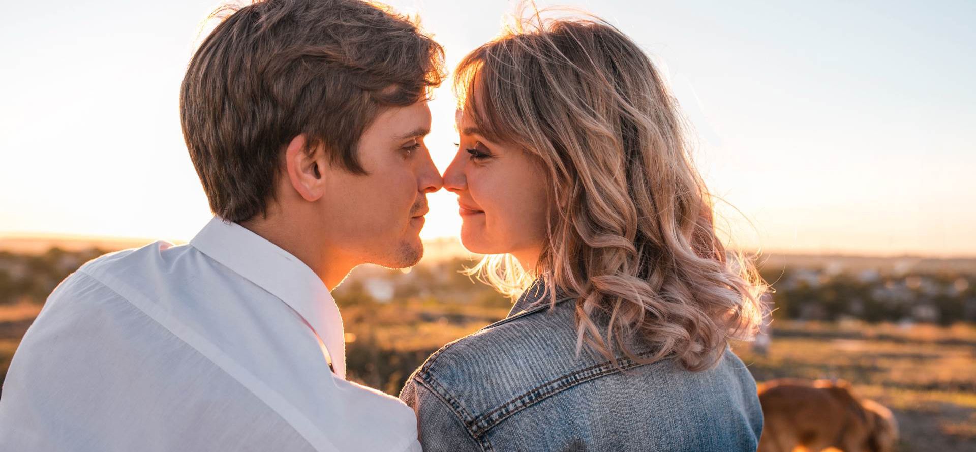 Gemini man kisses a woman.