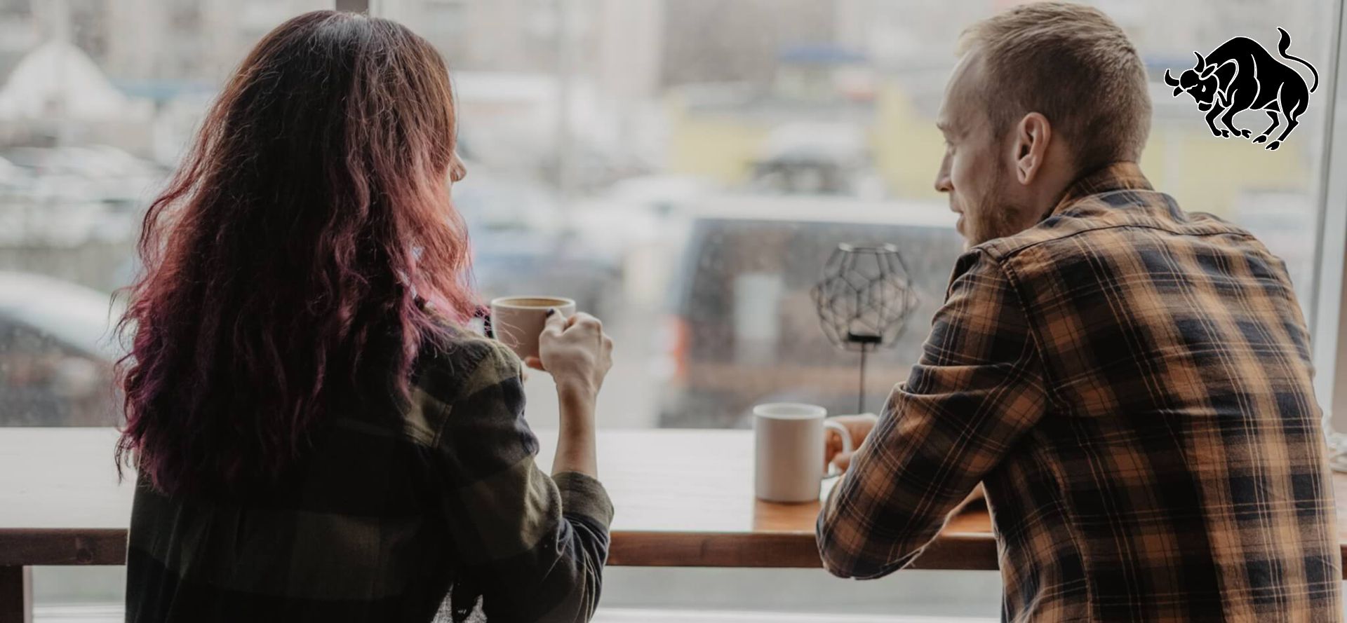 Man and woman sitting a cafe.