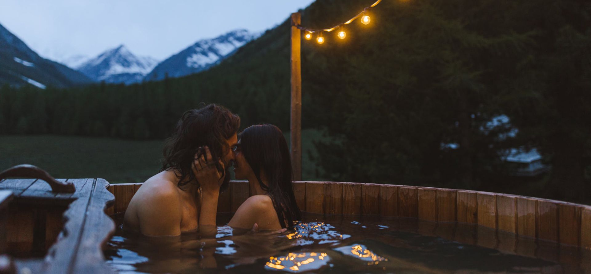 Taurus man with woman in a jacuzzi.