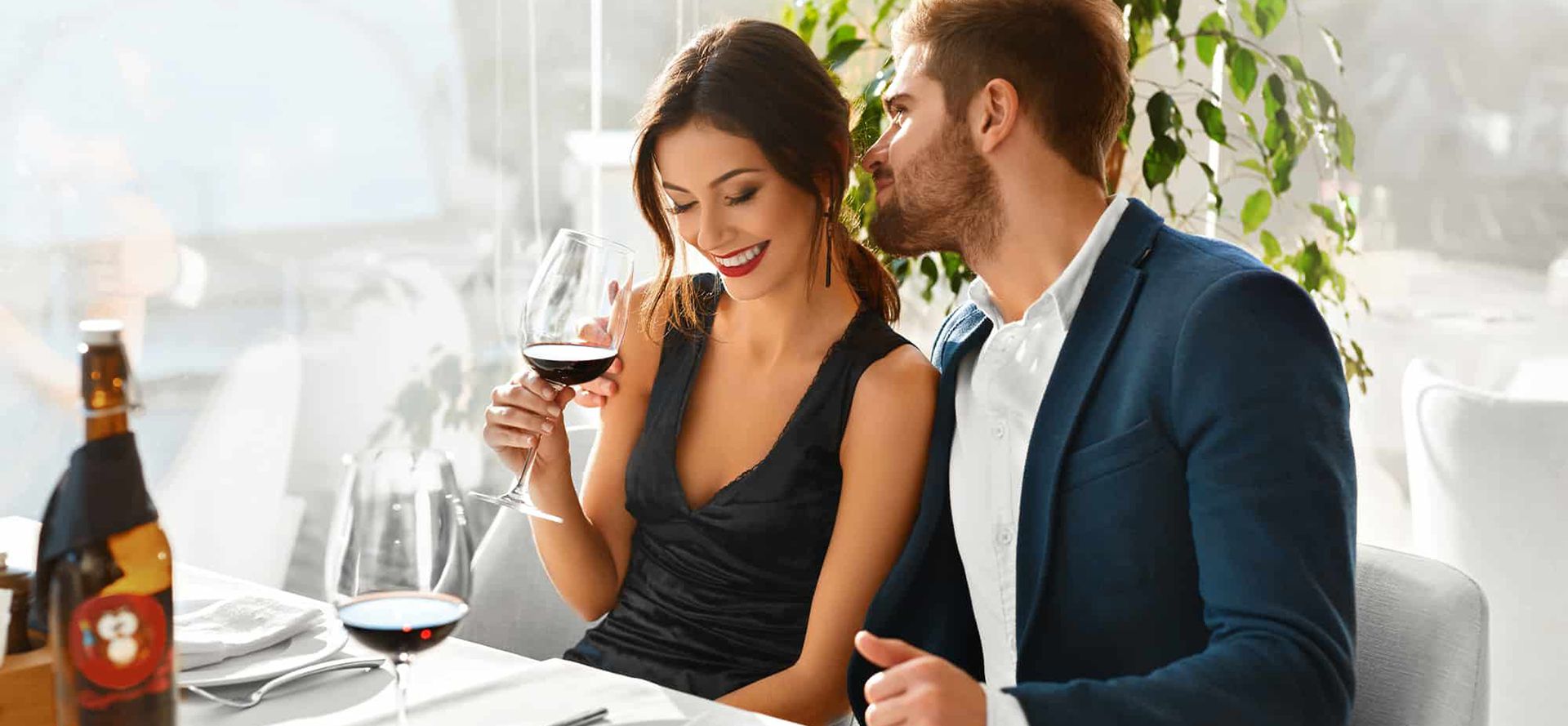 Libra man drinking wine with woman.