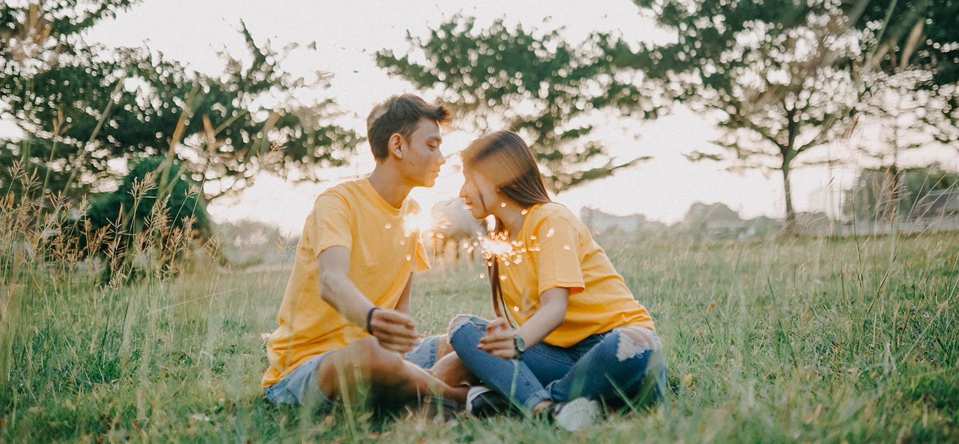 Scorpio man sitting in the field with woman.