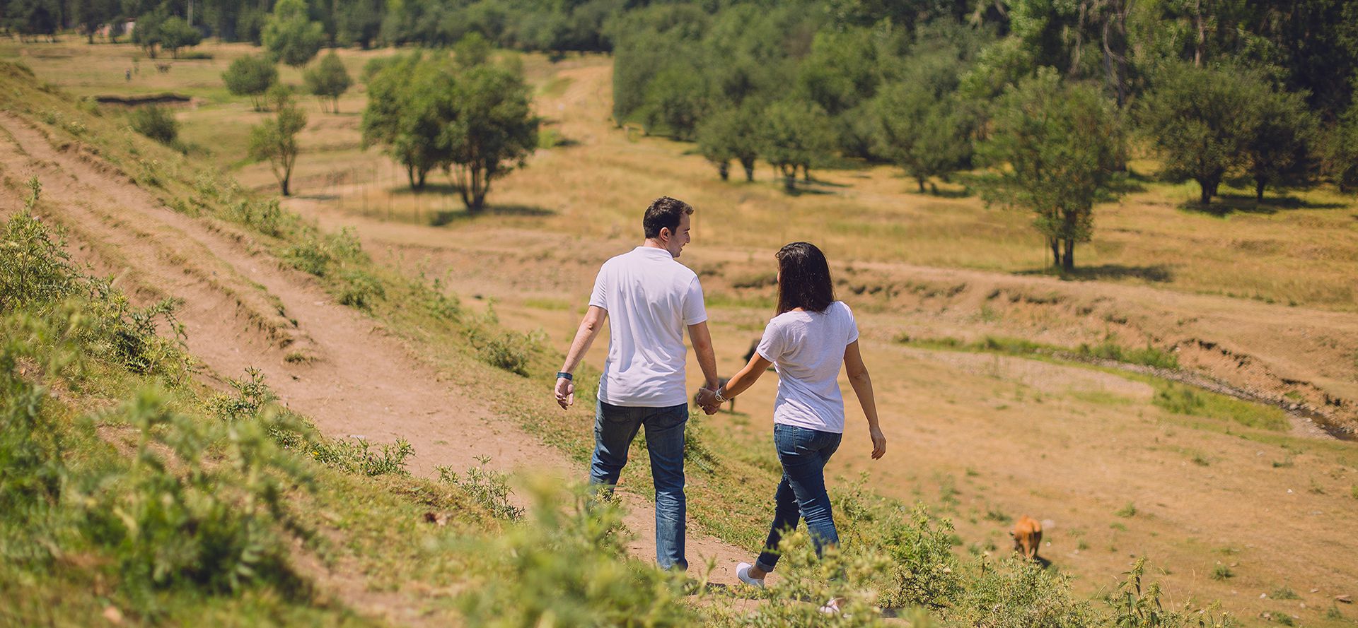 Taurus man walking in the mountains with woman.