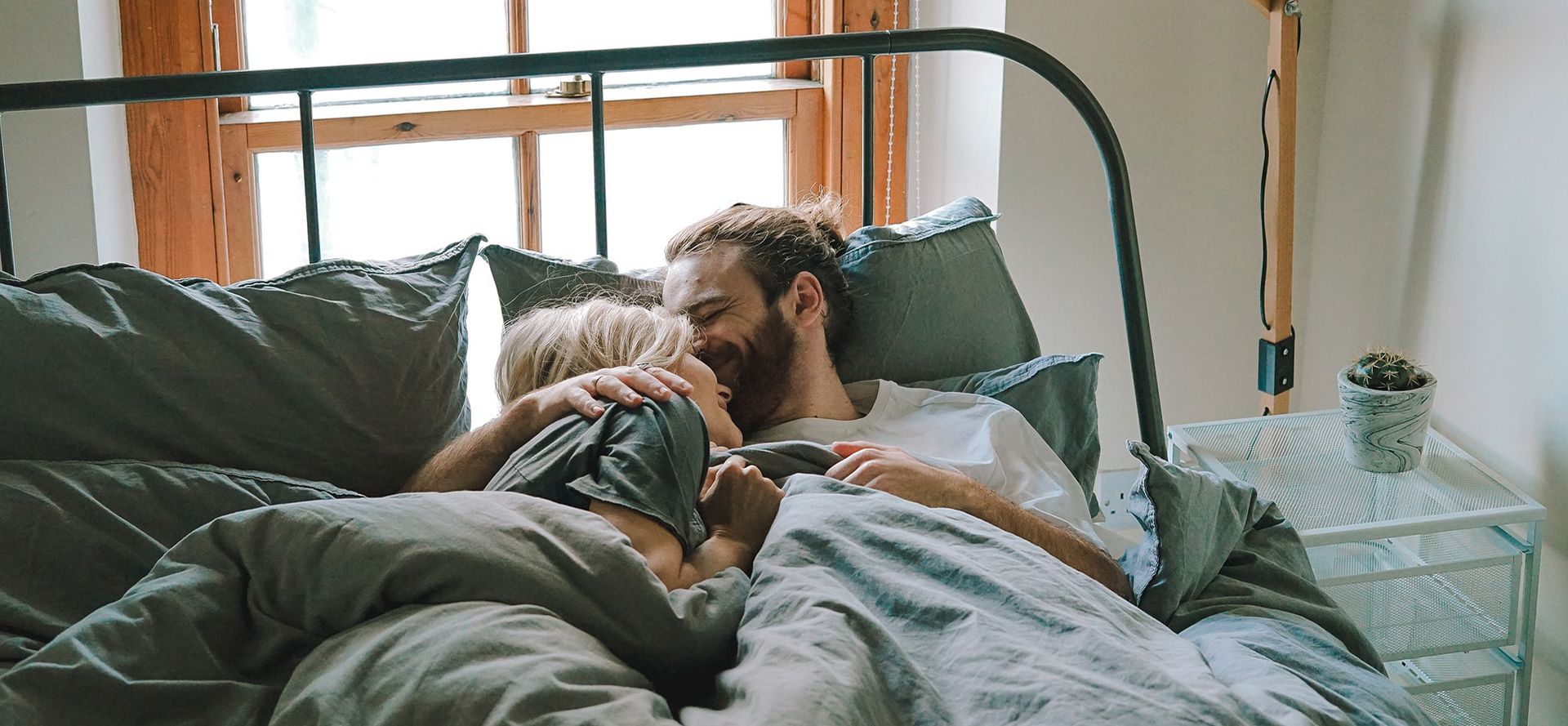 Capricorn man with woman in bed.