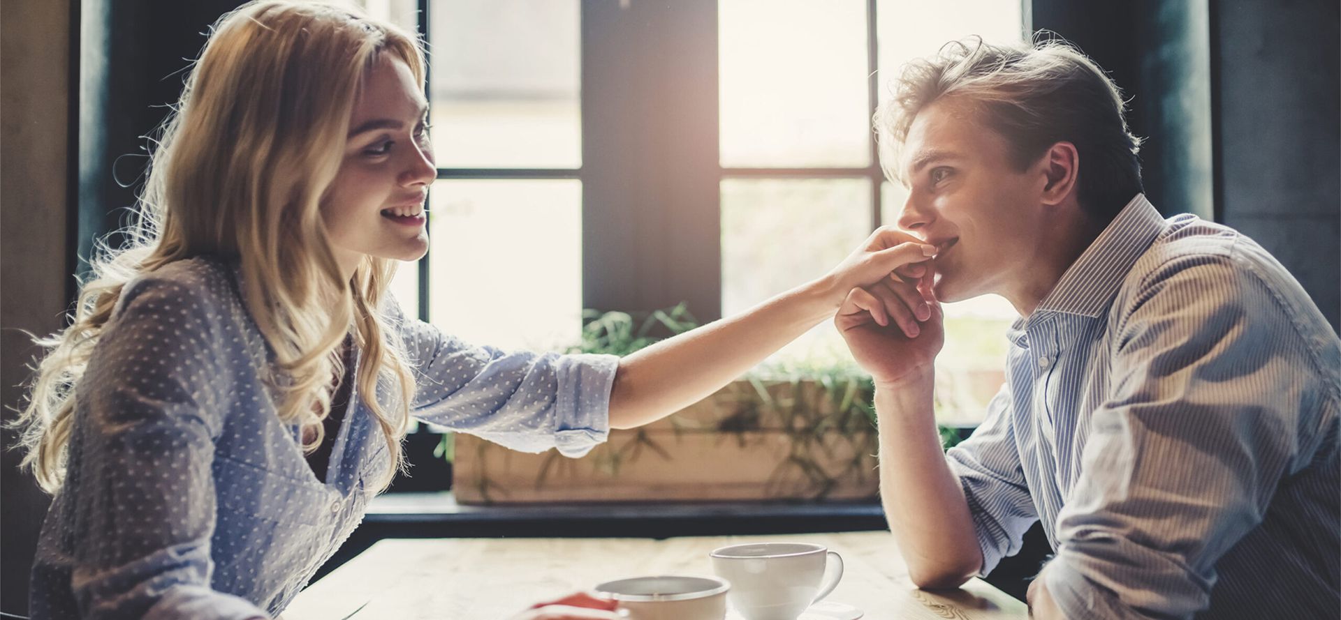 Virgo man kissing a female hand.